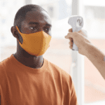 man-being-tested-for-temperature-with-covid