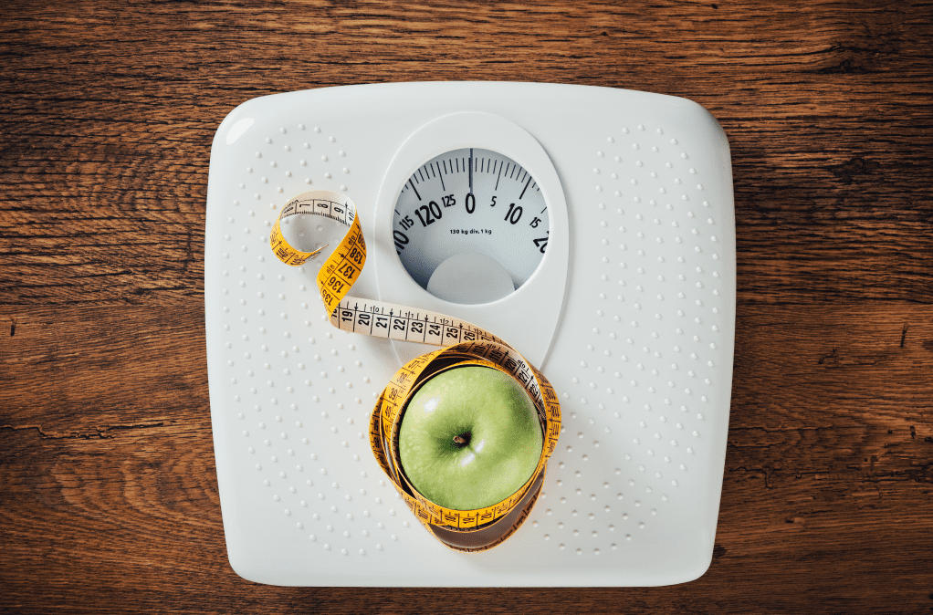 scale and measuring tape symbolizing weight loss which is another sea moss benefit for men