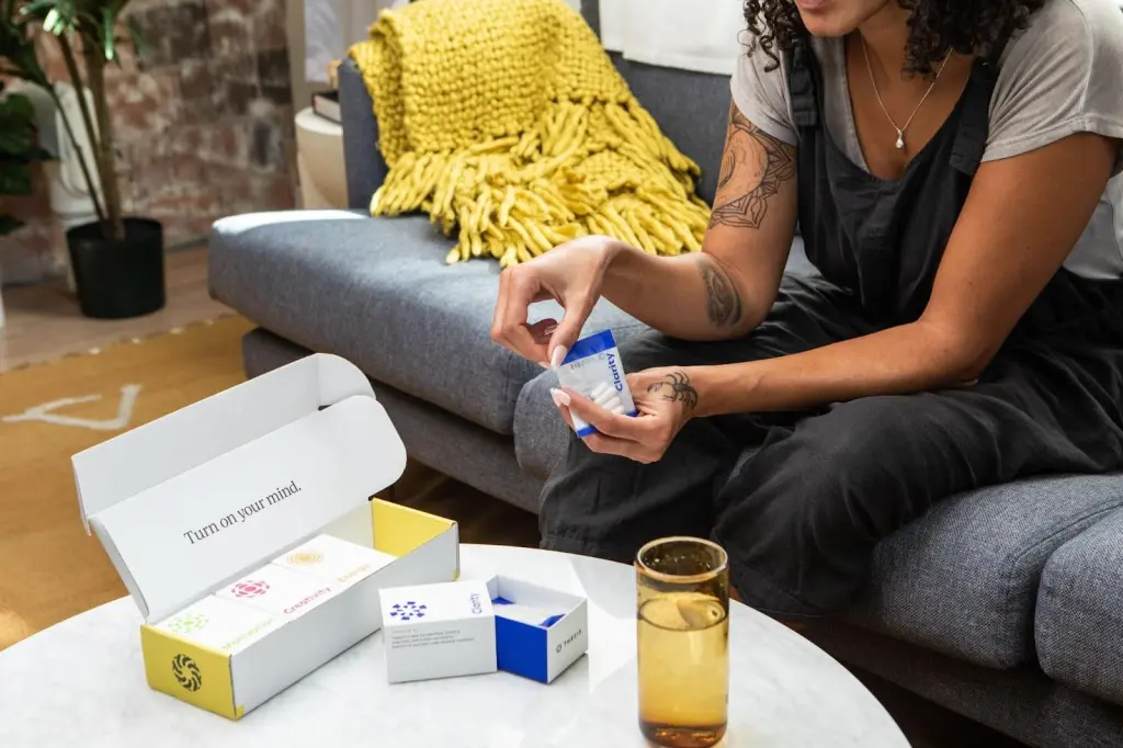 Thesis Product Being held By A Women with Box on table