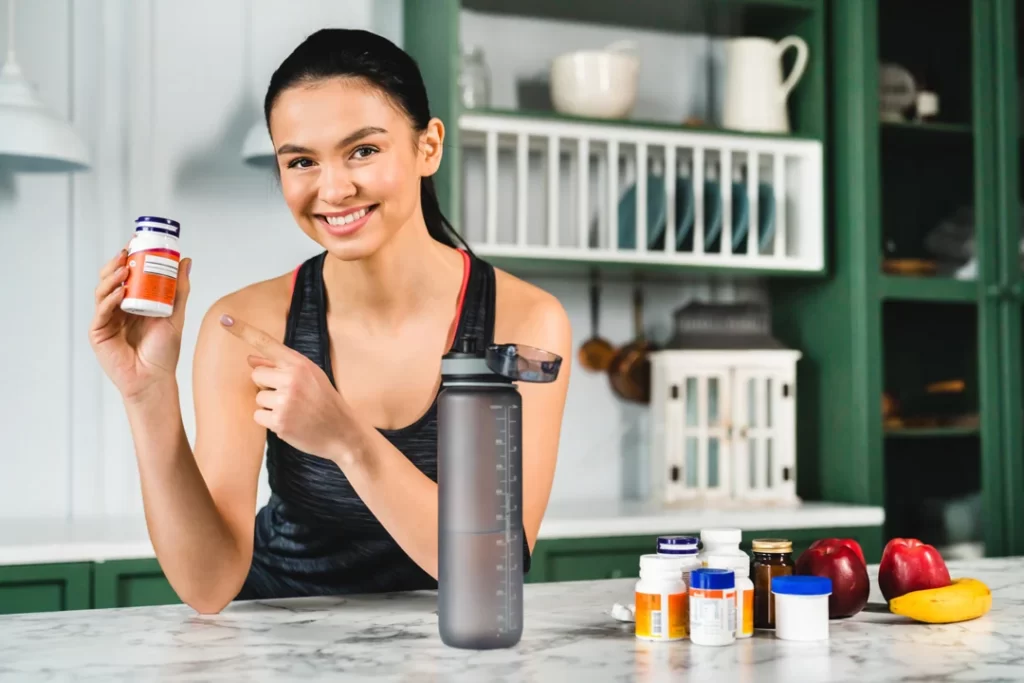 young slim caucasian girl pointing at vegan probiotic food supplement