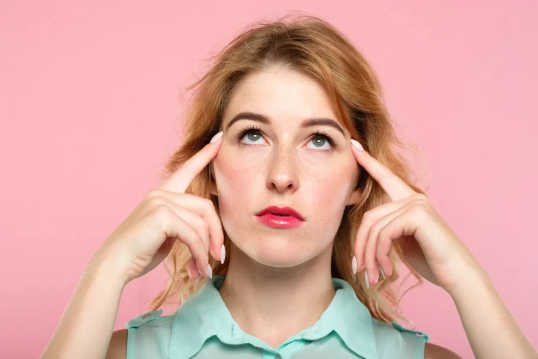 Young woman trying to focus after using stonehenge dynamic mushrooms.