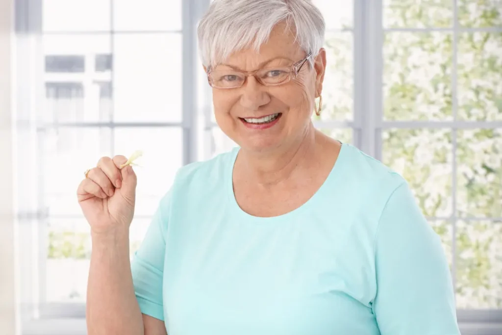 A lady eating gummies. 