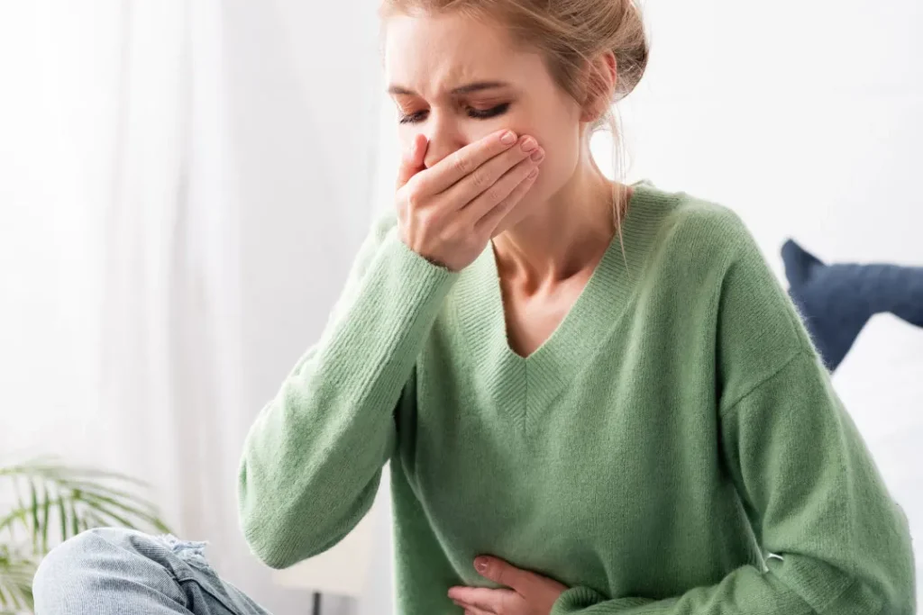 A lady having vomit.