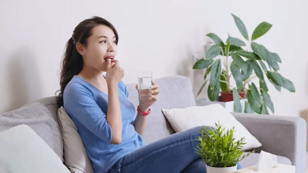 Girl taking multivitamins for healthy life