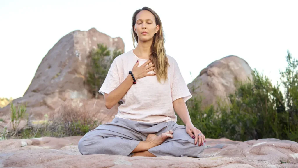 Lady is doing yoga. 